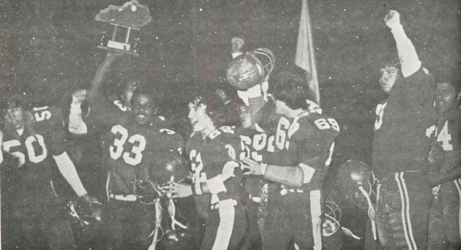 The Cawood Trojans celebrated after defeating Belfry for the school's first regional football title.