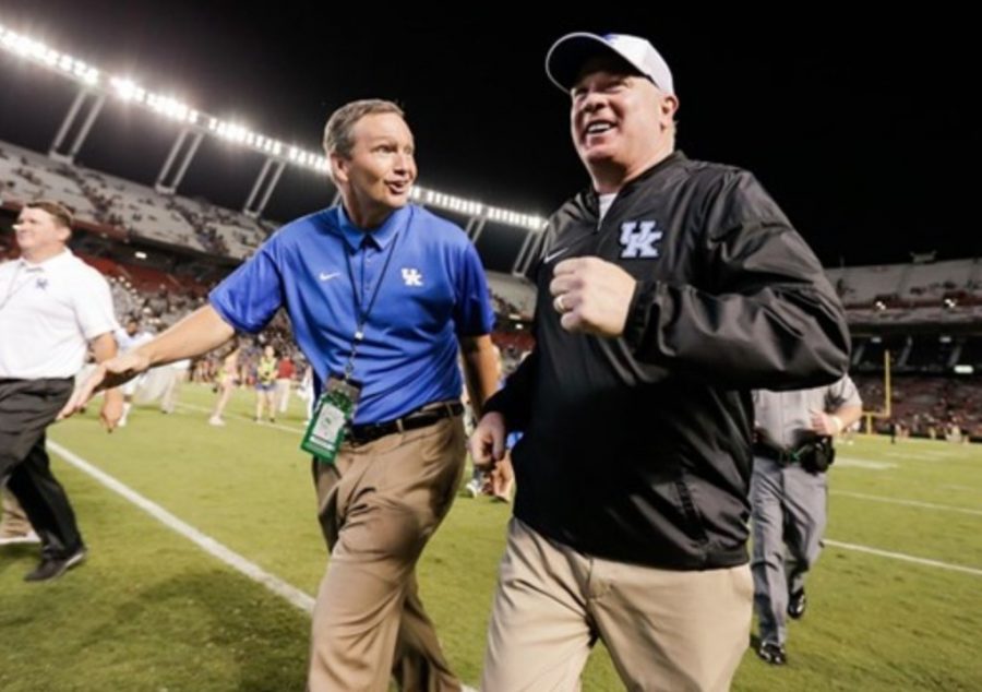 Mitch Barnhart and Mark Stoops are taking careful steps as schools re-open to allow athletes back on campus for voluntary workouts next month.