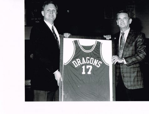 Former Harlan basketball standout Dickie Parsons had his jersey retired during ceremonies at Harlan High School in the 1990s. Parsons, pictured with Harlan Independent Schools Superintendent David Johnson, was a second-team all-stater in 1957 before going on to play basketball and baseball at the University of Kentucky. Parsons was the head baseball coach at UK from 1970 to 1972 and was an assistant coach from 1970 to 1980 with the UK basketball program, first with Adolph Rupp and then under Joe Hall.