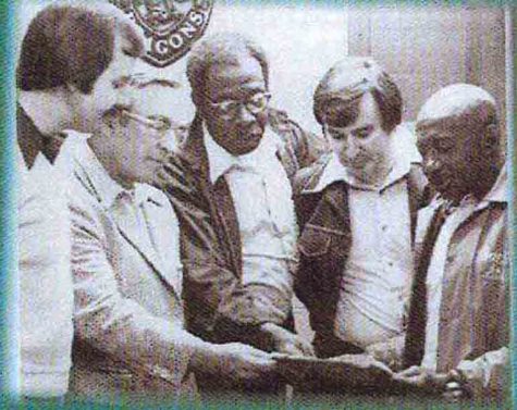 Harlan coaches, from left, Rick McCrary, Doyle Troutman, Tolbert Walker, David Davies and Doc Gray are pictured during the 1970s.