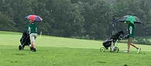 Harlan High School golfers Aiden Johnson and Kevin Lee battled the rain during the 13th Region All A Classic on Monday.