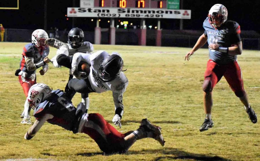 Harlan County senior running back/receiver Josh Swanner went over an Anderson County defender for a two-point conversion in Fridays win over the Bearcats.