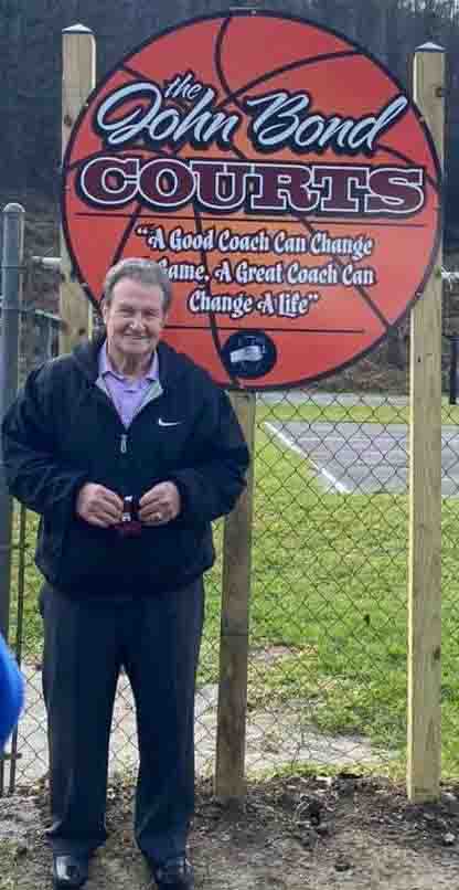 Former Cumberland girls basketball coach John Bond was honored Saturday when the basketball courts at the Walter Dick Park in Benham were named in his honor.