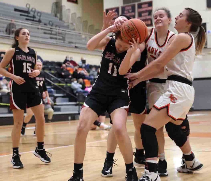 Harlan County guard Jacey Lewis battled for a rebound in Mondays game at Lynn Camp. Lewis scored 10 points in the Lady Bears 72-48 victory.