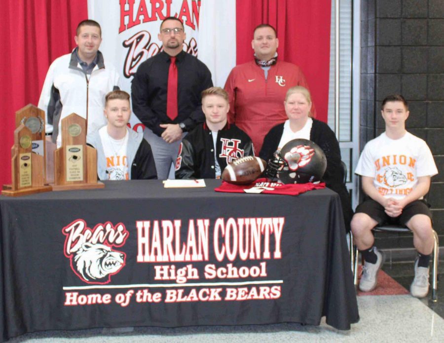 Harlan+County+High+School+senior+Matt+Brown+signed+with+Union+College+on+Thursday+where+he+will+continue+his+football+career.+Pictured+with+Brown+at+his+signing+ceremony+are%2C+front+row%2C+from+left%3A+Jacob+Brown%2C+Matt+Brown%2C+Shonda+Brown+and+Jayce+Brown%3B+back+row%3B+HCHS+athletic+director+Eugene+Farmer%2C+HCHS+coach+Eddie+Creech+and+HCHS+assistant+coach+Nick+Bray.%0A