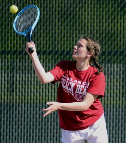 Harlan Countys Lindsay Hall returned a shot in action Monday against Harlan.