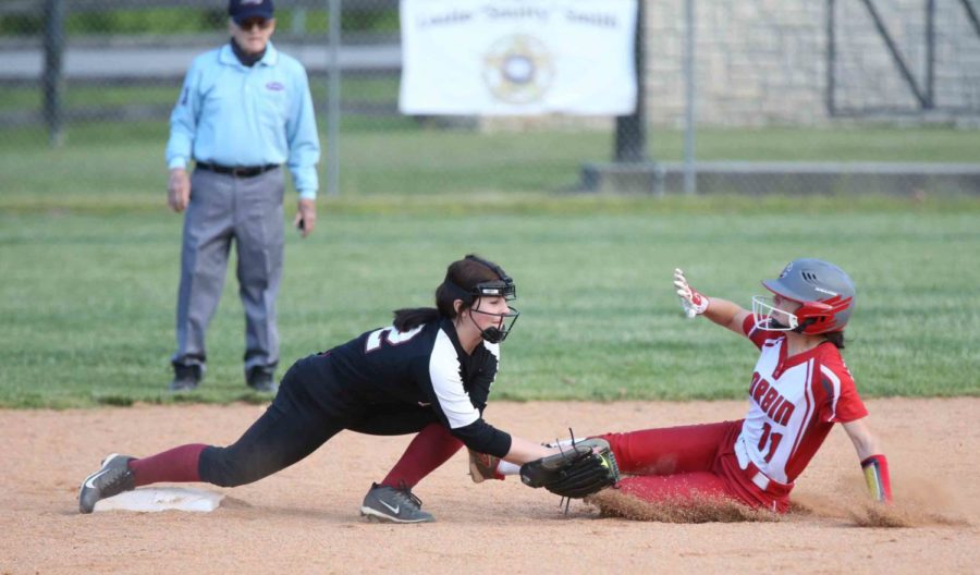 Corbins Alayna Reynolds slid into second base as Riley Maggard took a throw in Fridays game.