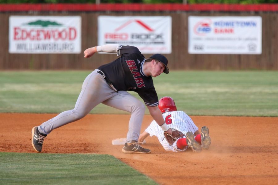 Whitley Countys Bryce Anderson was safe on a steal ahead of the tag from Harlan Countys Zac Collett in Mondays game in Williamsburg. The Colonels rolled to a 10-0 win in five innings.