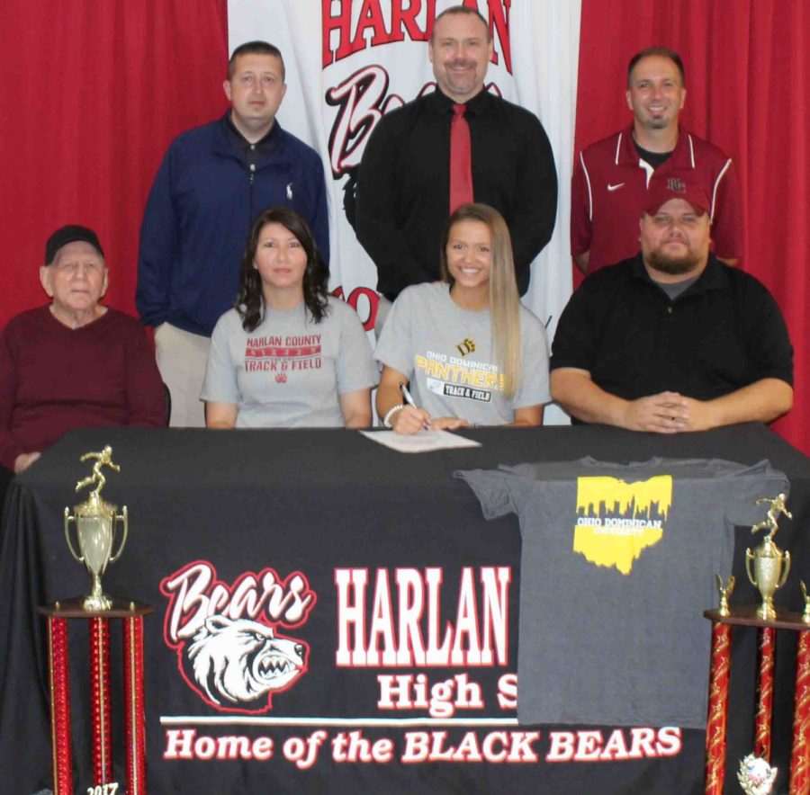 Harlan+County+High+School+senior+Kassy+Owens+signed+with+Ohio+Dominican+University+on+Friday+in+ceremonies+at+HCHS.+Owens+is+pictured+with+her+parents%2C+Joe+and+April+Owens%2C+and+her+grandfather%2C+Howard+Hensley%2C+as+well+as+HCHS+athletic+director+Eugene+Farmer%2C+HCHS+assistant+principal+Mike+Hensley+and+HCHS+track+coach+Ryan+VItatoe.%0A