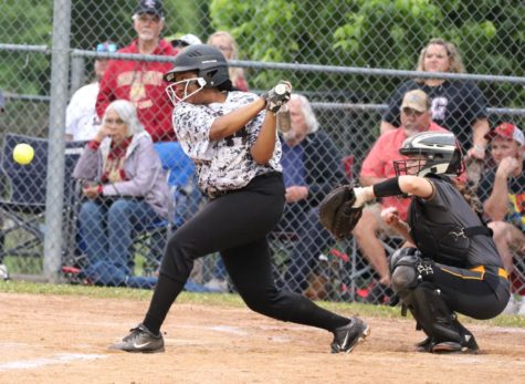 Harlan Countys Honesty Thomas connected on a pitch in district tournament action Wednesday. The Lady Bears were limited to three hits in a 14-4 loss.