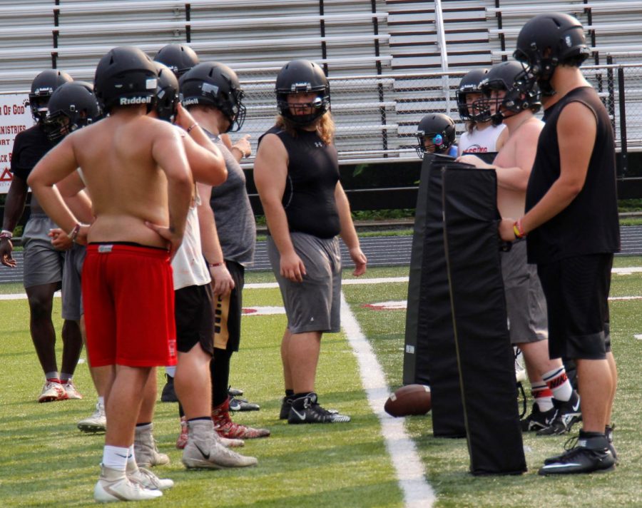 Harlan County senior center Ethan Shepherd prepared to snap the ball during a practice session earlier this summer. Shepherd is a returning starter on the Bears’ line.
