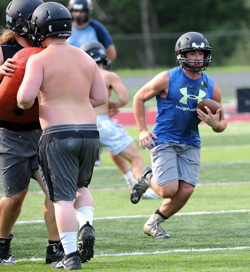Harlan County senior running back Luke Carr ran through a drill in a practice session earlier this summer. The Bears open their regular season schedule on Friday at home against South Laurel.