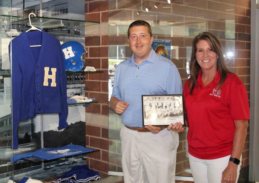 A photo of Halls 1955 baseball team, which won a regional title and finished second in the state tournament, was added to the memorabilia section at Harlan County High School in the front entrance at the school. HCHS Principal Kathy Napier and athletic director Eugene Farmer placed the photo with other items connected to Hall High School.
