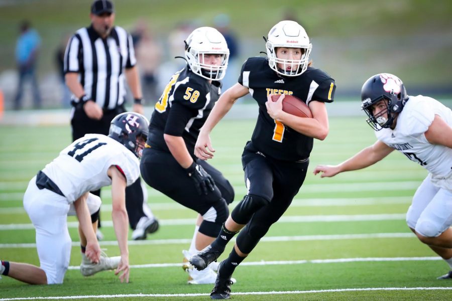 Clay County quarterback Tate Rice broke free for a big gain in Monday's game against Harlan County. RIce threw for five touchdowns in the Tigers' 40-20 victory.