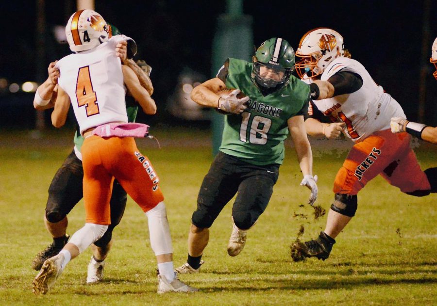 Harlan+running+back+Dylan+Middleton+found+an+opening+against+the+Williamsburg+defense+last+week.+Middleton+scored+a+touchdown+Friday+and+added+three+two-point+conversions+in+the+Green+Dragons+46-22+win+at+Lynn+Camp.