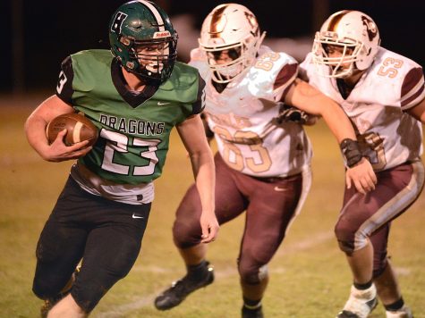 Harlan junior tailback Jayden Ward ran for 98 yards and scored three touchdowns as the Green Dragons rallied for a 38-36 win Friday over visiting Leslie County.