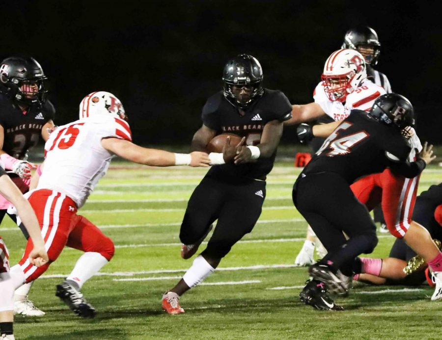 Harlan County senior Demarco Hopkins ran through a hole in the Perry Central defense during Fridays game. Hopkins ran for 171 yards, including a 75-yard touchdown, as the Bears gained 332 yards on the ground.