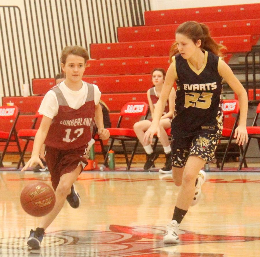 Cumberlands Alli Adams brought the ball down the court against Evarts Trinity Jones in Saturdays seventh- and eighth-grade county tournament game.