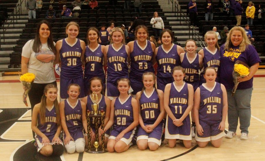 The Wallins Lady Devils captured the seventh- and eighth-grade county championship on Thursday with a 32-22 win over Rosspoint at Harlan County High School.