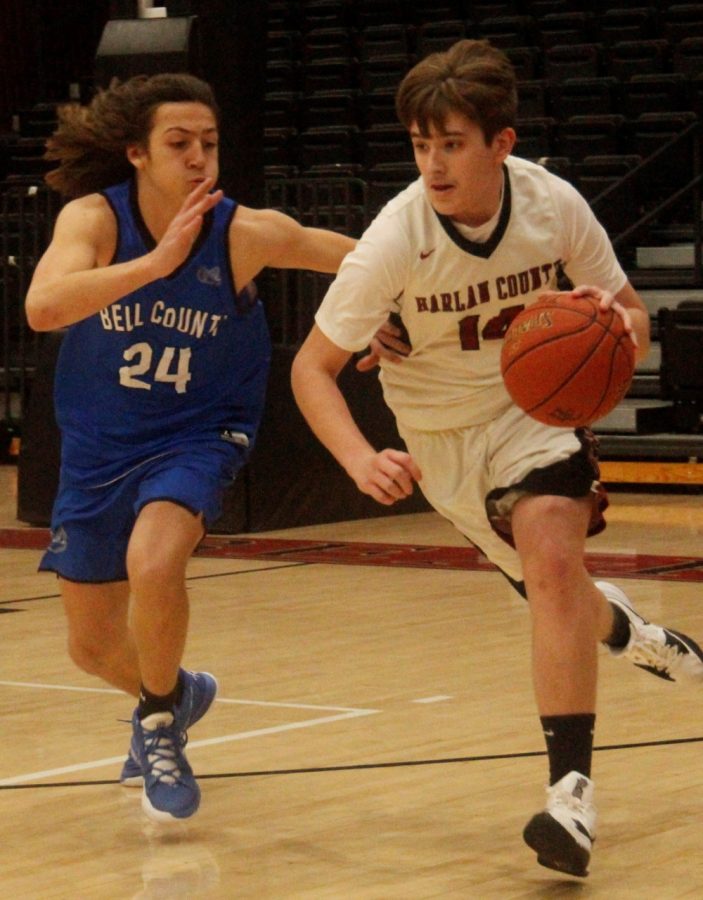 Harlan County point guard Brody Napier raced down the court as Bell Countys Caden Huff defended in a freshman game Monday.