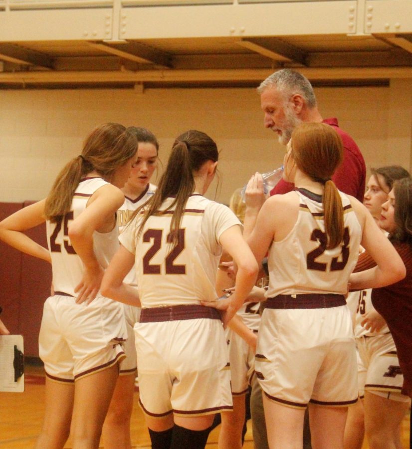 Pineville coach Elgie Green talked to the Lady Lions during a timeout in Thursdays game.