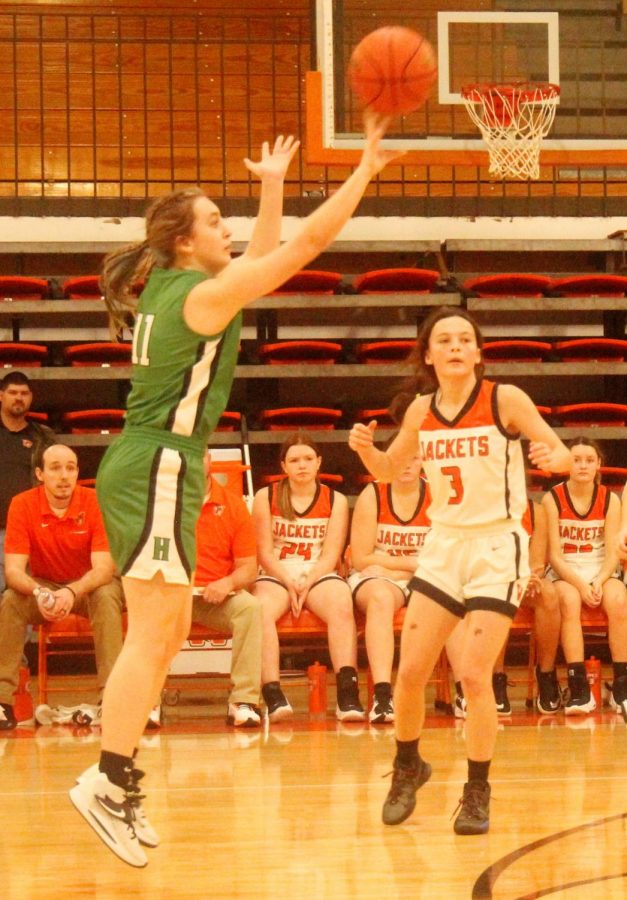 Harlan guard Faith Hoskins put up a shot in Thursdays game at Williamsburg in the Bill Perkins Holiday Classic. The Lady Dragons hit nine 3-pointers in a 70-54 victory.