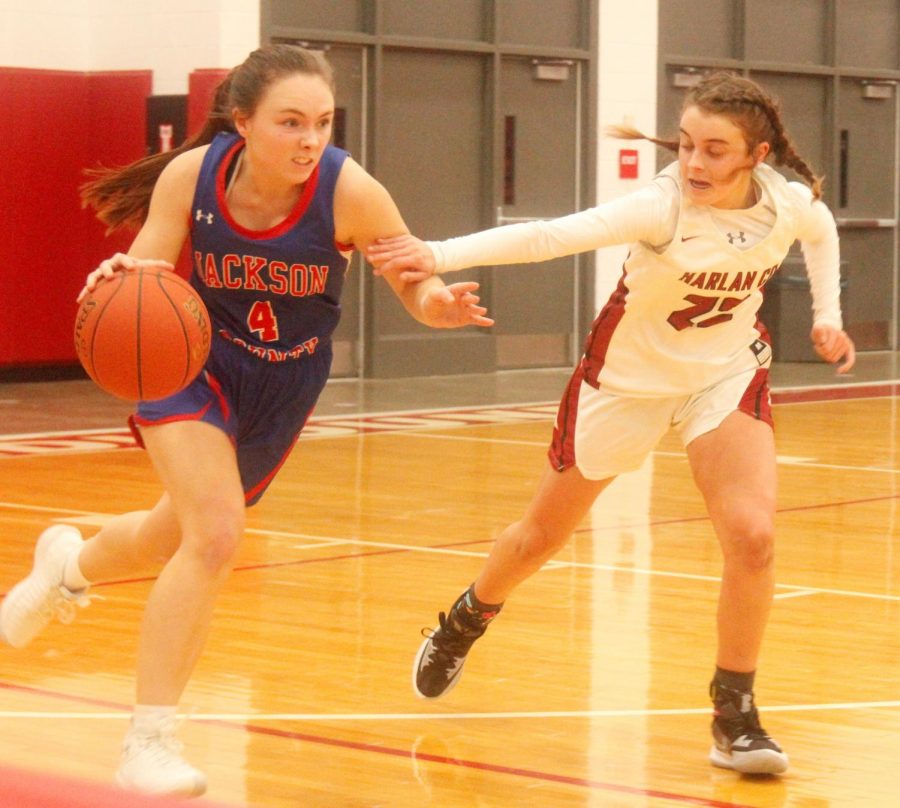 Harlan Countys Kylie Jones chased Jackson County guard Natalie Carl in tournament action Wednesday in Corbin.