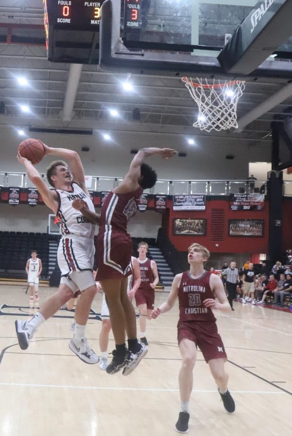 Harlan County guard Jonah Swanner twisted his way to the basket in action from the Harlan County Hoops Extravaganza. Swanner scored 18 points in the Bears win over Metrolina Christian, N.C.
