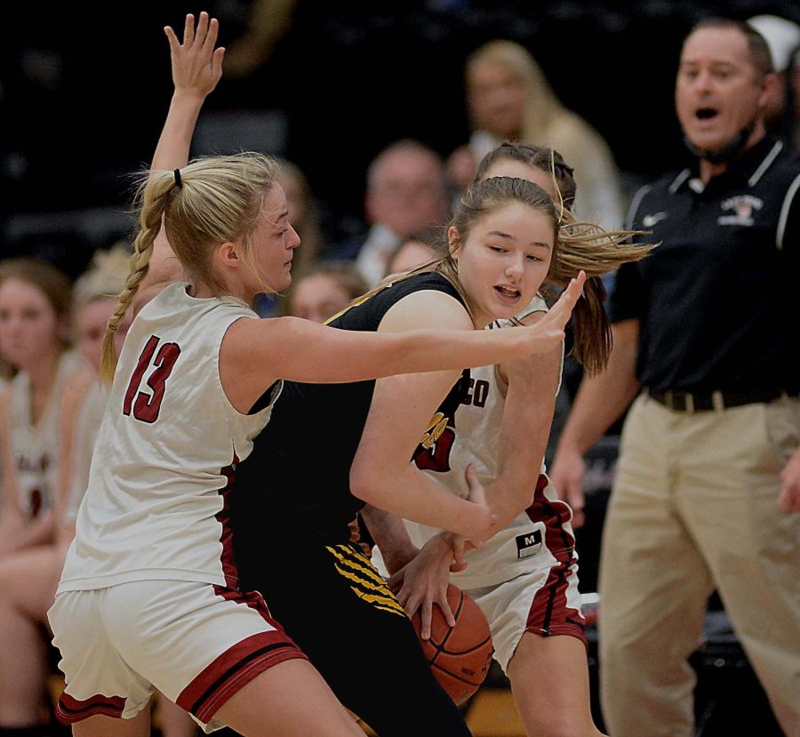 Harlan County guards Taytum Griffin and Ella Karst trapped a Clay County player during Thursdays game. The Lady Bears picked up their intensity on defense in the second half to rally for a 55-50 win.