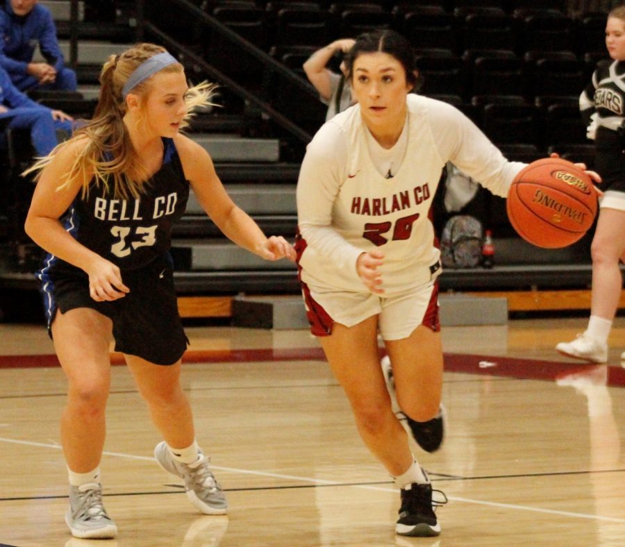 Harlan Countys Jaylin Smith worked the ball down the court as Bell Countys Mataya Ausmus defended in Tuesdays game. The Lady Czts claimed a 65-40 victory.