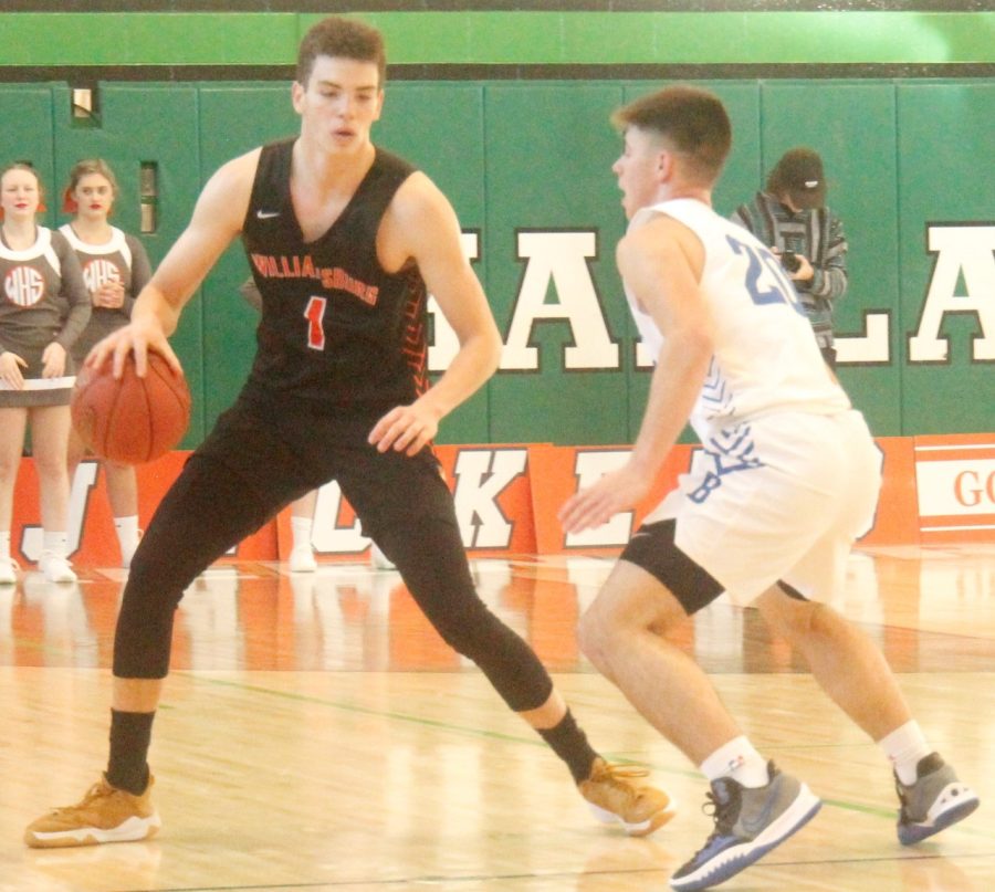 WIlliamsburg guard Micah Steely looked for an opening against Barbourvilles Tanner Smith in All A Classic tournament action Saturday. Steely was limited to eight points as the Tigers advanced with a 65-64 win.