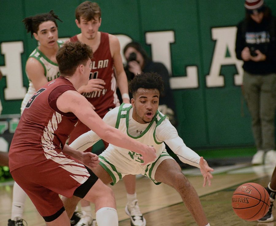 Harlans Jaedyn Gist reached for a pass made by Harlan Countys Maddox Huff on Tuesday. Gist scored 23 in the Green Dragons 64-56 win.