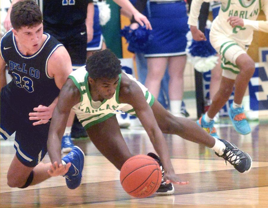 Harlans Will Austin and Bell Countys Cameron Burnett went after a loose ball in Tuesdays district clash. Harlan held off a Bell rally to win 68-61.
