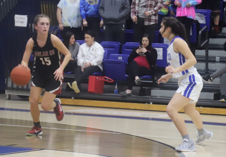 Harlan County guard Ella Karst brought the ball down court in district tournament action Thursday.