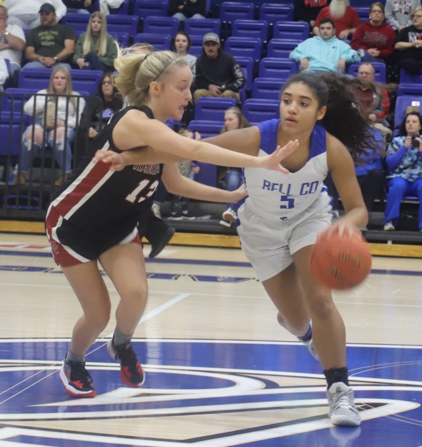 Bell County guard Nadine Johnson worked against Harlan Countys Taytum Griffin in district tournament action Thursday. Johnson scored 10 points in the Lady Cats 53-38 win.