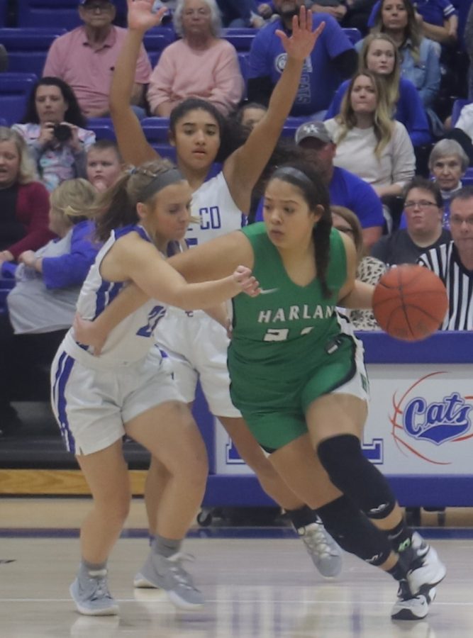Harlan wing Aymanni Wynn worked her way to the basket in Mondays 52nd District Tournament game against Bell County. The host Lady Cats advanced with an 81-46 win.
