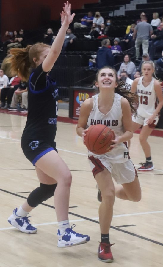 Ella Karst went to the basket for two of her 15 points in Harlan Countys 57-49 win over Letcher Central.