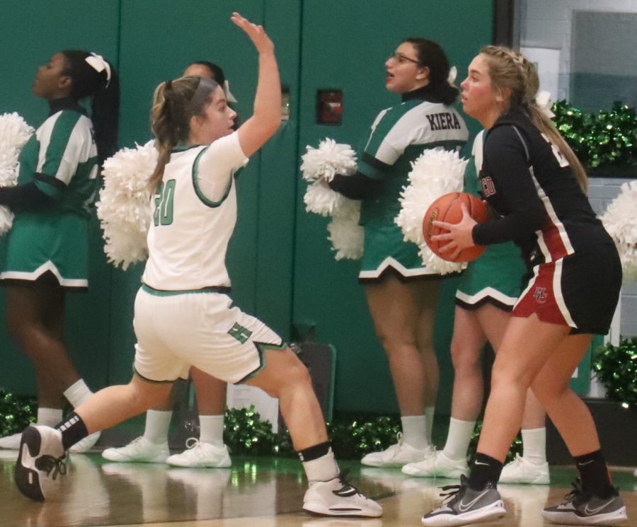 HCHS guard Haiiley Austin looked to pass around Harlans Emma Owens during Tuesdays game. Austin scored six points in the Lady Bears 65-53 win.