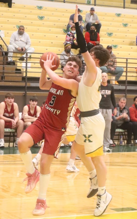 Harlan County freshman guard Maddox Huff worked to the basket for two of his 16 points in the Bears loss to St. Xavier at Kentucky State University.