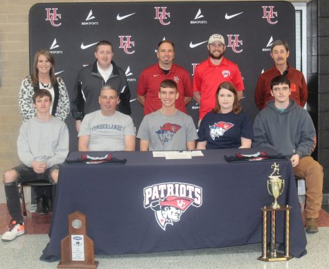 Harlan County High School senior Matt Yeary signed with the University of the Cumberlands on Monday to continue his track/cross country career in college. Pictured with Yeary are, front row, from left: family members Andrew Yeary, Winston Yeary, Amanda Yeary and Ethan Robinson; back row: HCHS Principal Kathy Napier, HCHS athletic director Eugene Farmer, HCHS coach Ryan Vitatoe, Cumberlands assistant coach Jamen Helton and Tom Vicini.