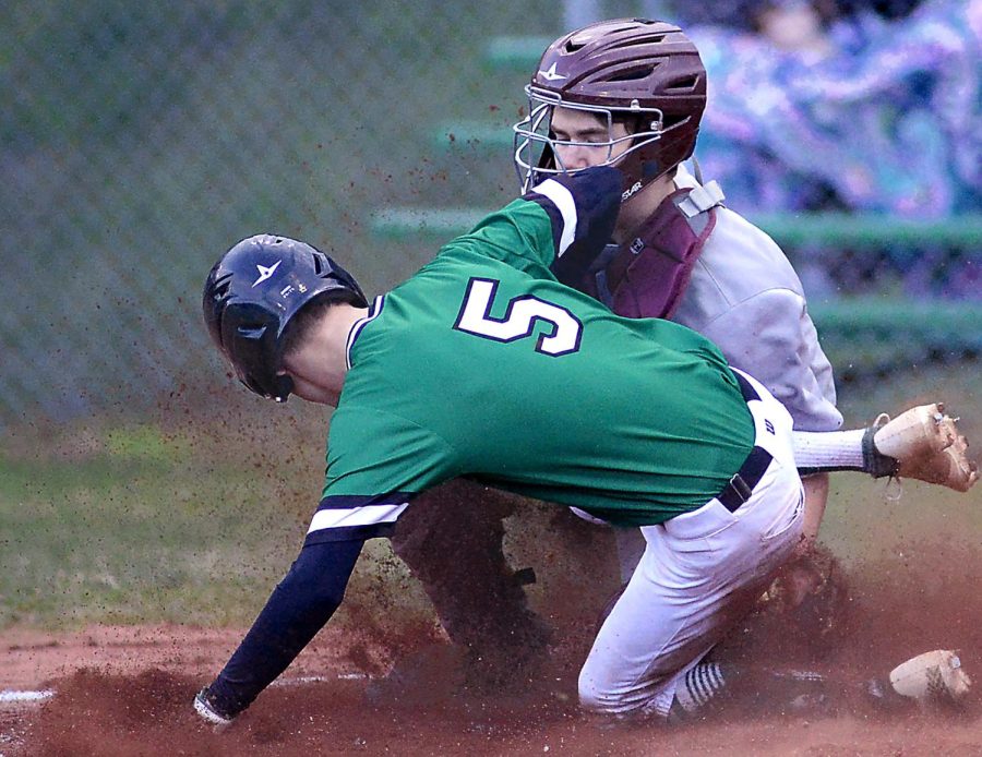 Harlans Evan Browning slid home with a run during the Green Dragons 17-2 win Thursday over visiting Pineville in the 13th Region All A Classic semifinals. Harlan will travel to Jackson County on Friday in the championship game.