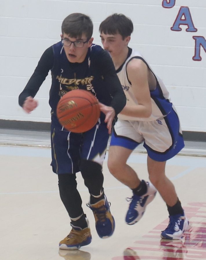 Evarts Ashton Sizemore headed down the court in Tuesdays semifinal game against Rosspoint in the county tournament.