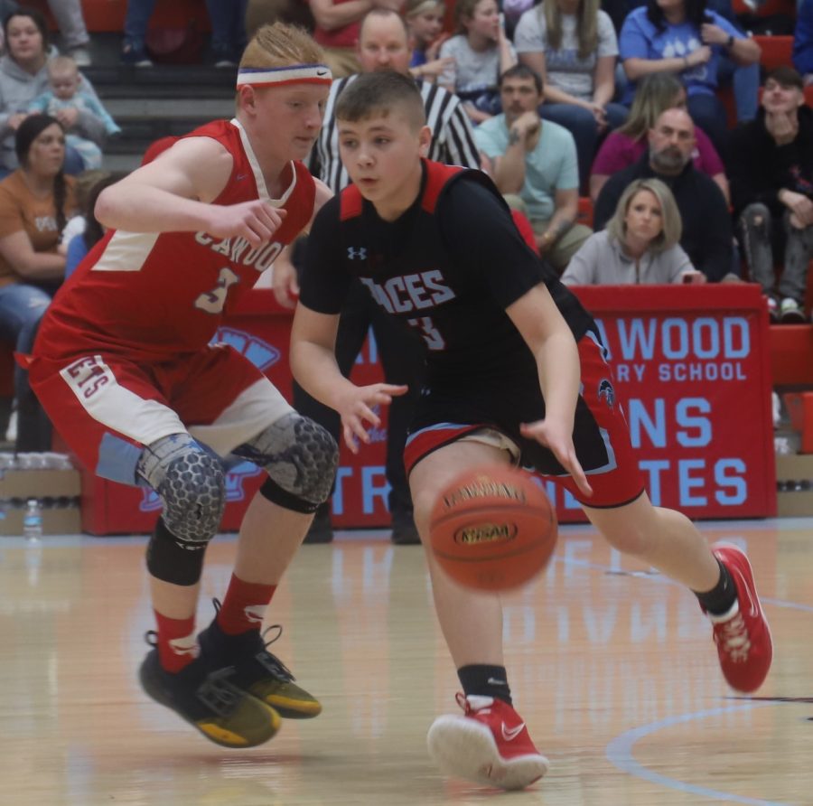 James A. Cawood guard Landon Brock worked around Cawoods Brayden Fultz in tournament action Tuesday.