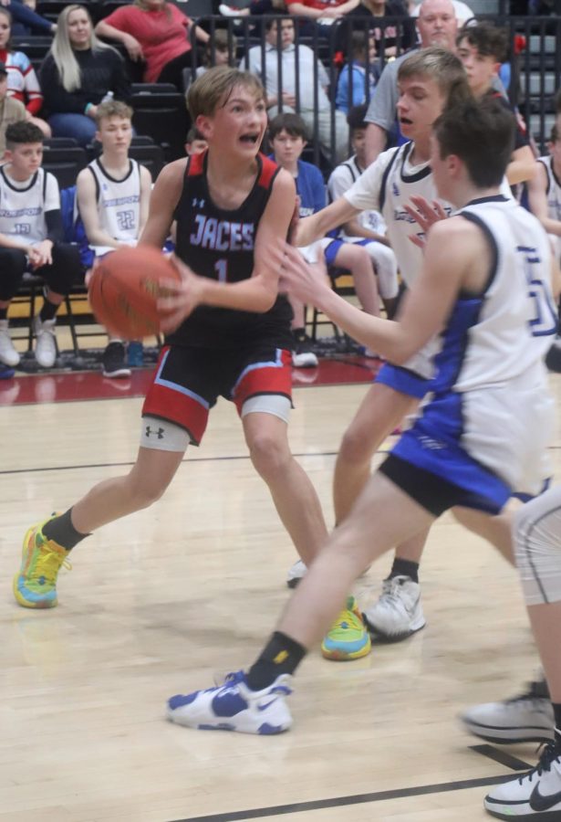 James A. Cawood guard Brennan Blevins worked toward the basket on Thursday in the seventh- and eighth-grade county finals. Blevins scored 14i in the Trojans 52-40 loss.