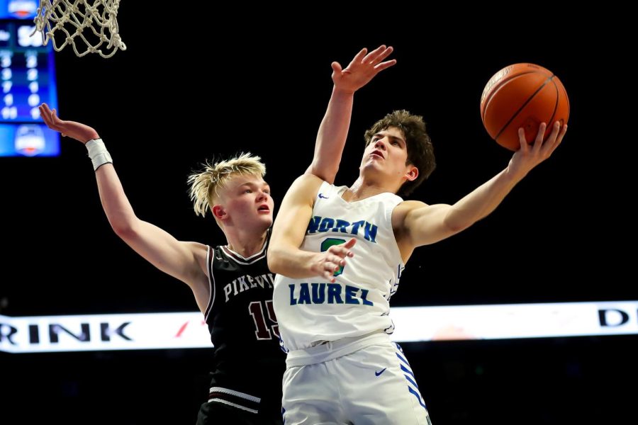 North Laurel's Reed Sheppard went to the basket against Pikevill's Rylee Samons in state tournament action Thursday. Samons scored 23 points in the Panthers' 59-51 victory.