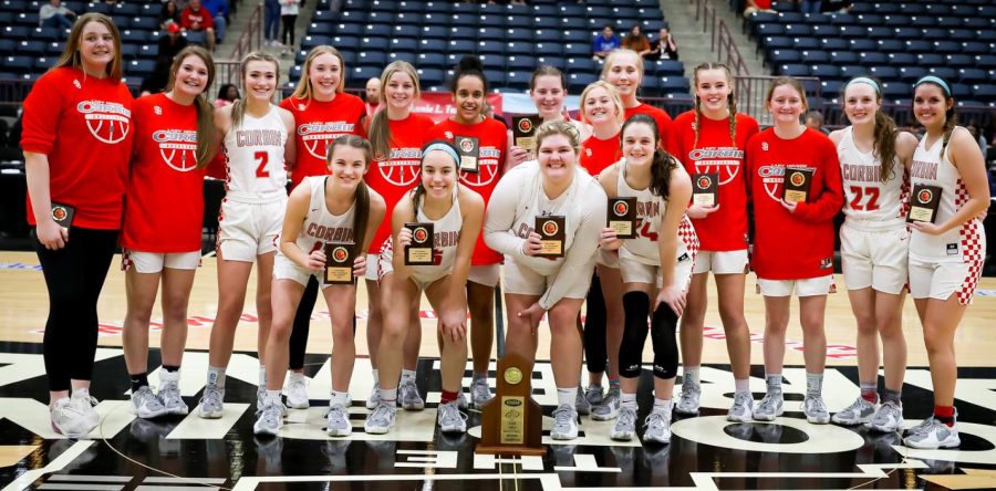 The Corbin Lady Hounds are pictured with their 13th Region championship trophy after Saturdays overtime win over South Laurel.