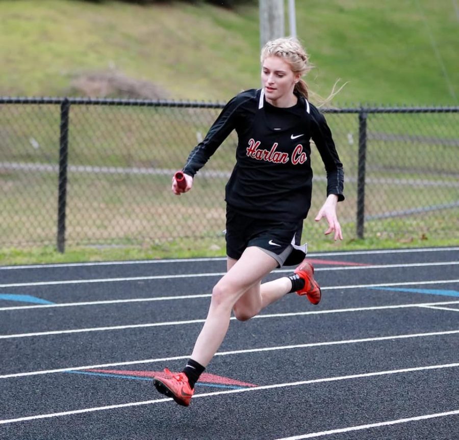 Jaylin Preston helped lead the Harlan County to a first-place finish in their opening meet of the season on Friday.