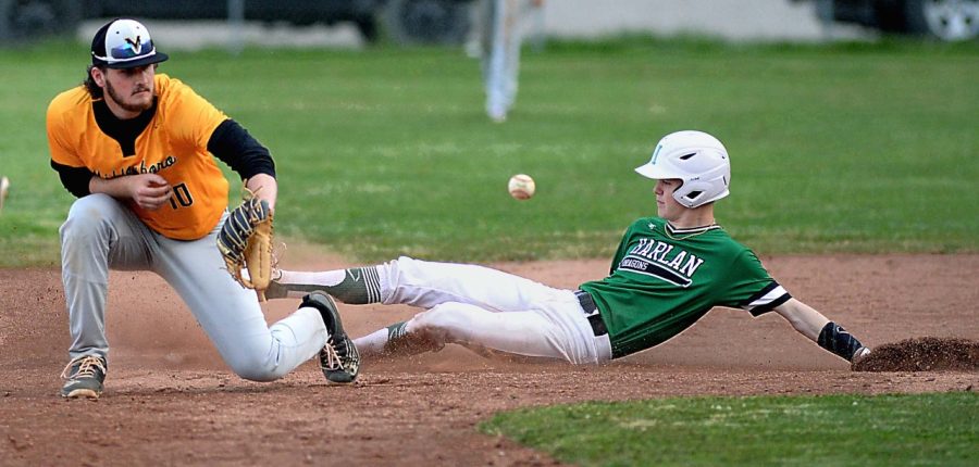 Harlans Evan Browing slid into second base during Wednesdays district clash against visiting Middlesboro. Browning had two hits in the Dragons 5-1 loss.
