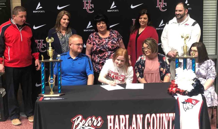 Harlan County High School senior Destiney Adams signed with the University of the Cumberlands earlier this week and will be a member of the college’s dance team. Pictured with Adams in a signing ceremony at HCHS are her father, Greg Adams; her mother, Joyce Adams; and her sister, Jade Adams. The back row includes HCHS athletic director Eugene Farmer, HCHS Principal Kathy Napier, Harlan County dance coaches Anna Carruba and Lisa Layne and Cumberlands dance coach R.J .Conroy.