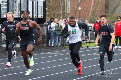 Harlan Countys Demarco Hopkins won the 100 meters ahead of teammate Luke Kelly and Harlans Johann Gist on Friday in the Coal Miners Memorial Invitational.
